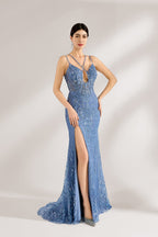 Bathed in soft light, a woman stuns in a blue mermaid - cut gown. It has thin criss - cross straps, a deep V - neckline, and is covered with intricate sequin embroidery, plus a high side slit. The shimmering details lend an air of opulence, perfect for grand galas or red - carpet moments.1