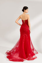 A woman stands against a light background, wearing a red mermaid - style gown. It features a strapless sweetheart neckline, intricate floral lace embroidery throughout, and a flowing tulle skirt with a train. The elegant design creates a glamorous and romantic look, perfect for formal events like proms or weddings.5
