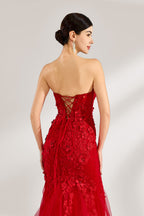 A woman stands against a light background, wearing a red mermaid - style gown. It features a strapless sweetheart neckline, intricate floral lace embroidery throughout, and a flowing tulle skirt with a train. The elegant design creates a glamorous and romantic look, perfect for formal events like proms or weddings.6