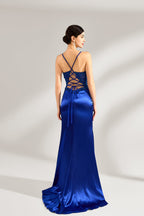 A woman stands against a light background, wearing a royal - blue satin gown. It features thin criss - cross straps at the back, intricate lace embroidery on the bodice, and a mermaid silhouette with a trailing skirt. The elegant design creates a glamorous look, perfect for formal events like galas or red - carpet occasions.
2