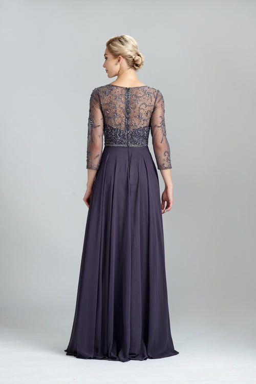Back view of dark navy beaded lace long-sleeve dress with gathered waist and full skirt