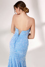 A woman stands against a light - colored backdrop, donning a stunning light blue mermaid - style evening gown. The strapless design features a sweetheart neckline, perfectly highlighting her shoulders and collarbone. The entire gown is intricately adorned with shimmering sequins, creating a dazzling effect that catches the light with every movement. This glamorous and elegant piece is an ideal choice for formal galas and upscale evening affairs.6