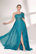 Against a light - hued backdrop, a woman dons a teal sequin gown with an one - shoulder design. It features a bow - detailed strap, a sheer waist panel, and a high side slit. The sparkling sequins and unique silhouette radiate glamour, perfect for formal dinners or galas.1