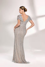 A woman stands against a light background, wearing a silver - grey beaded gown. It features off - shoulder sleeves, a V - neckline, and a mermaid silhouette. The intricate bead patterns and sheer fabric exude elegance, perfect for formal galas or weddings, radiating timeless charm.2