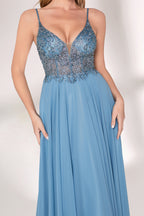 A woman with long, wavy blonde hair and a graceful pose wears a light - blue chiffon gown. It has thin straps, a beaded and lace - detailed bodice, and a flowing, floor - length skirt. Paired with understated heels, the outfit exudes elegance, perfect for formal events like galas or weddings.05
