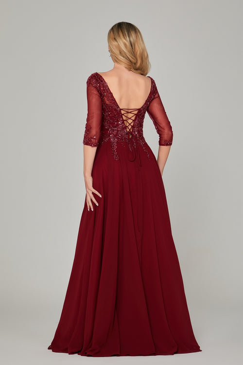 Burgundy gown with lace bodice and crisscross open back straps, three-quarter sleeves