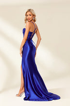 This is a stunning royal blue satin gown, strapless dress with a high slit, elegant, slim figure, standing against a plain white background, soft lighting, full-length shot, sophisticated and glamorous, fashion photography, high heel shoes, silver with clear straps, confident pose, elegant and classy, minimalistic background, no accessories, no jewelry, smooth texture, formal wear.32687-02