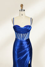 Royal blue satin prom dress with sheer corset bodice, side slit & drape. Luxe, eye-catching design—perfect for bulk orders in premium formal collections.