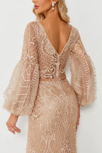 Champagne beaded V-neck gown with geometric textured pattern and long sheer puff sleeves