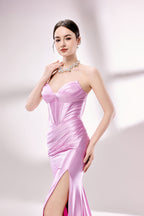 photo of a beautiful woman, elegant evening gown, pink satin, strapless, corset top, high slit, standing pose, long legs, slim figure, fair skin, brunette hair in a bun, large hoop earrings, statement necklace, grey high heels, studio setting, soft lighting, white background, minimalistic, fashion photography, glamour, sophisticated, full body shot, model looking directly at camera.D-138-02