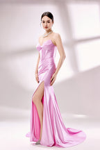 photo of a beautiful woman, elegant evening gown, pink satin, strapless, corset top, high slit, standing pose, long legs, slim figure, fair skin, brunette hair in a bun, large hoop earrings, statement necklace, grey high heels, studio setting, soft lighting, white background, minimalistic, fashion photography, glamour, sophisticated, full body shot, model looking directly at camera.D-138-06