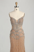 Beaded halter mermaid gown with ornate V-neck and cascading chest pattern