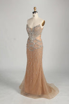 Champagne mermaid gown with beaded halter neckline and shoulder cape
