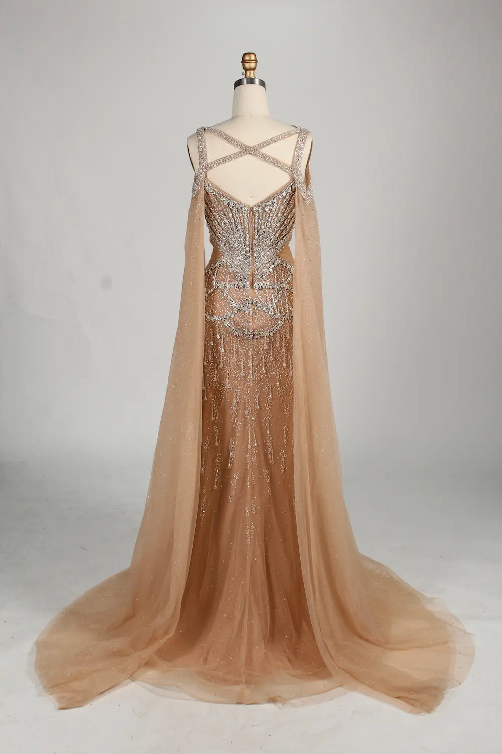 Backless champagne mermaid dress with crisscross straps and beadwork