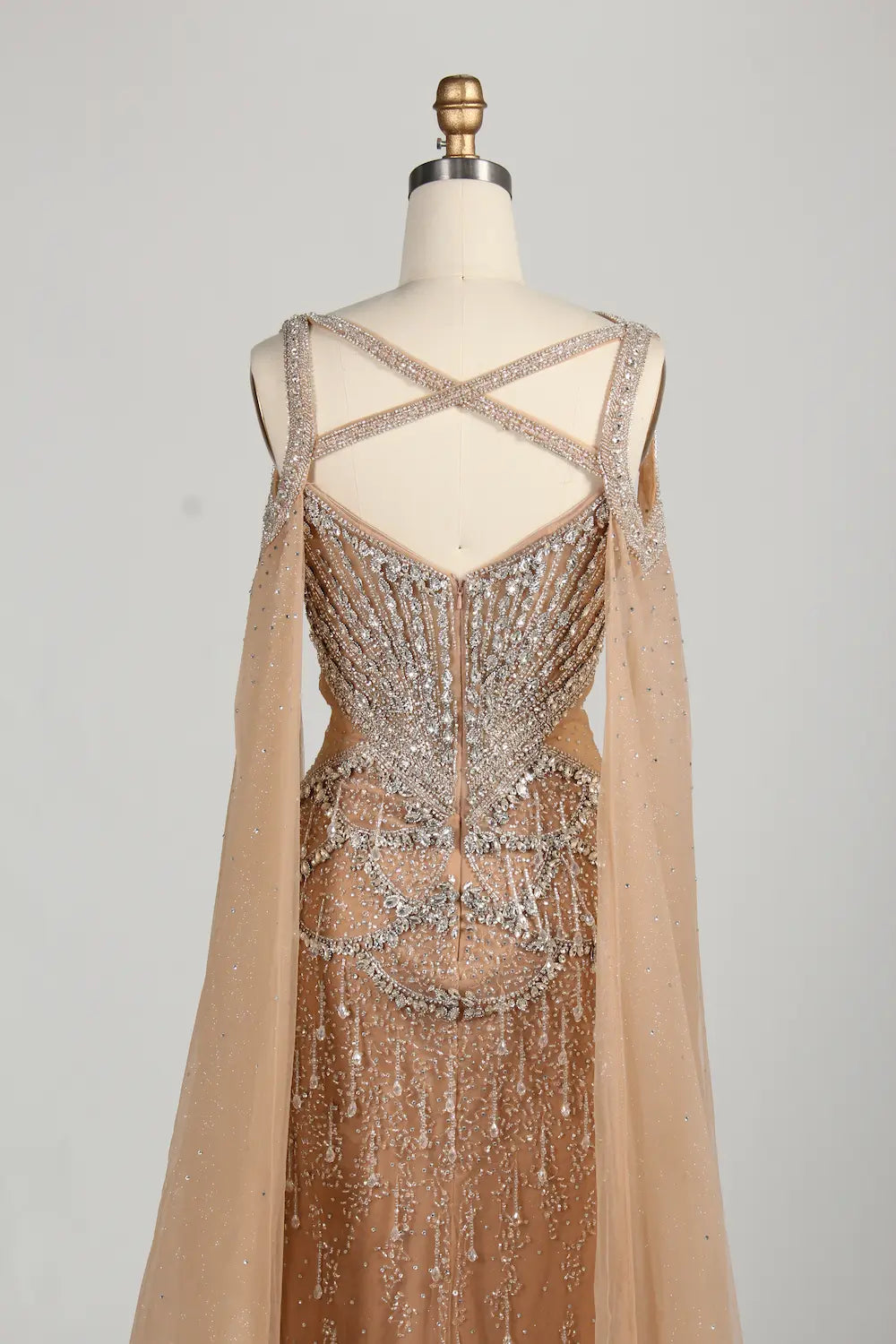 Back view: crisscross strap champagne mermaid dress with full tulle panels