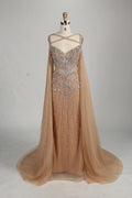 Front view: beaded halter champagne mermaid gown with draped sleeve capes
