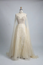 Ivory A-line cape gown with crystal beaded high-neck bodice and sheer cape