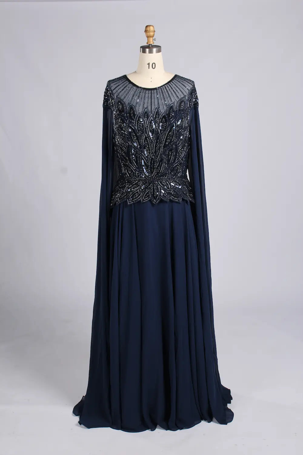 Navy A-line chiffon mother-of-the-bride dress with beaded V-neck bodice and cape sleeves