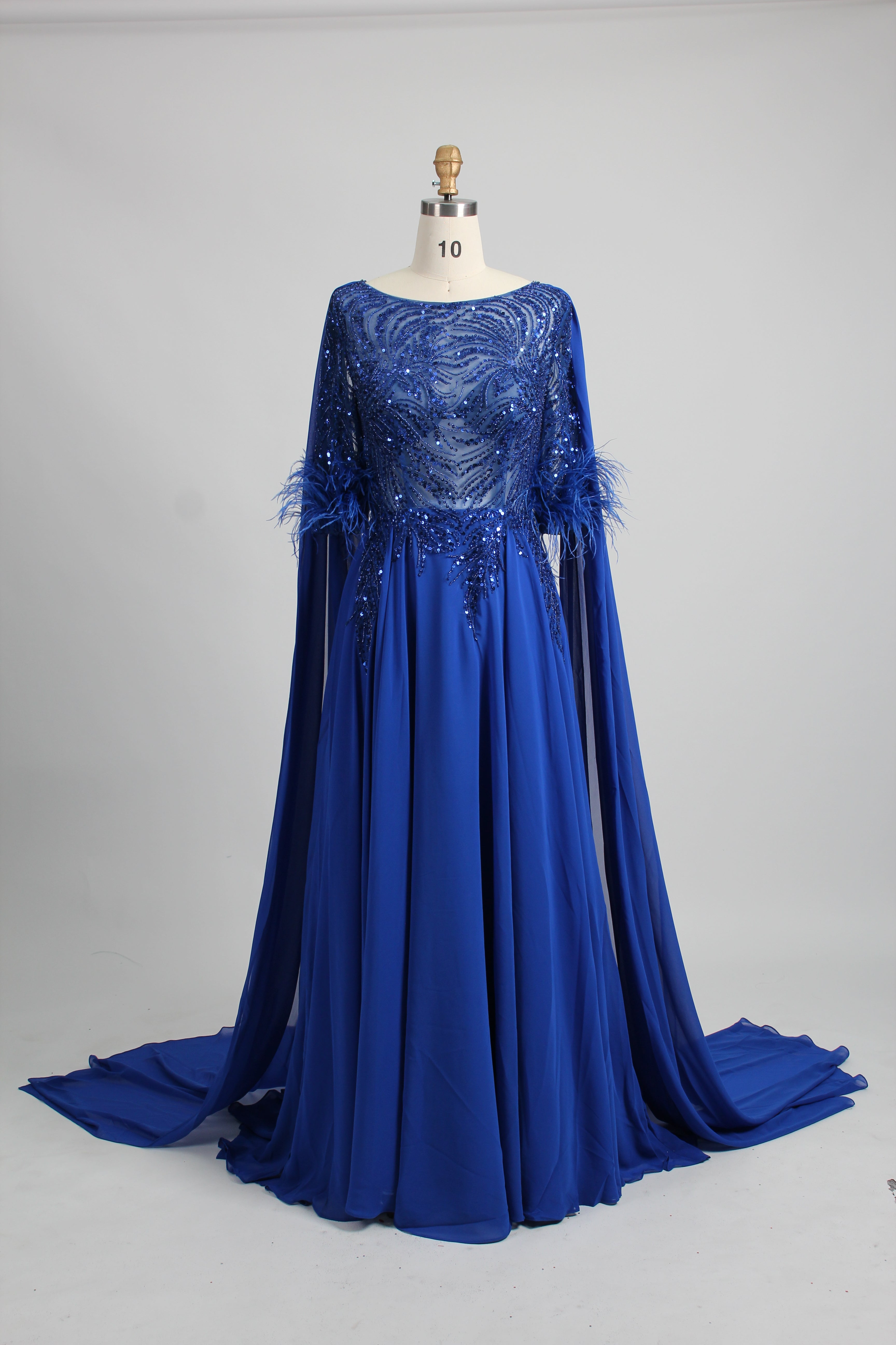 Blue sequin evening dress with cape sleeves and feather-trim cuffs, flowing skirt