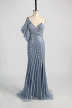 Blue one-shoulder beaded gown with fitted bodice and flowing tiered skirt