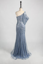 Blue one-shoulder beaded lace gown with diagonal strap and flowing skirt