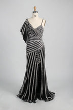 Black and silver beaded one-shoulder gown with draped shoulder and long skirt