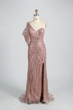 Pink one-shoulder beaded gown with lace-like texture and long sheer hem