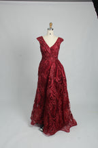 Red sleeveless evening dress with V-neck beaded details and full gathered skirt