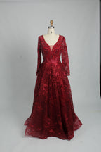 Red beaded tulle long-sleeve ball gown with plunging V-neck and flared hem