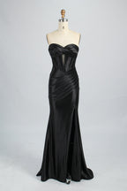 This is a strapless royal - blue gown. It features a twisted - front design at the bustline, with a sheer panel in the middle of the bodice. The waist is cinched with ruched detailing, and the skirt is mermaid - shaped with a high side slit. Paired with silver - glittered heels, it exudes elegance and sensuality, perfect for formal events like galas or balls.8