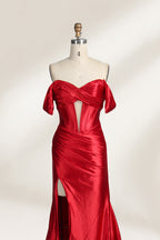  mannequin showcases a strapless red satin gown against a light - hued backdrop. It features an off - shoulder, twisted bodice with a sheer panel and a high side slit. The smooth satin fabric and elegant silhouette radiate sophistication, ideal for formal dinners or charity balls.3