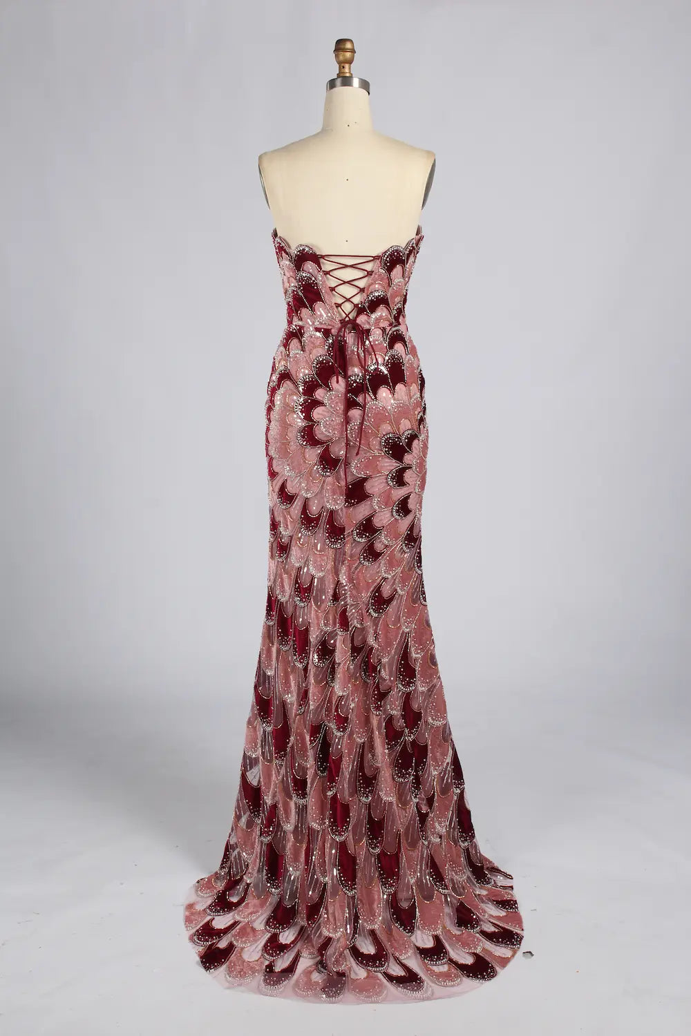 Strapless mermaid evening dress in rose and burgundy sequin feather pattern, full length