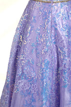 This is a purple evening gown. It has a strapless, sweetheart neckline. The bodice features intricate patterns, cinched at the waist with a thin belt. The floor - length skirt, made of tulle, is covered in iridescent embroidery. Perfect for formal events, it exudes elegance and a dreamy vibe.006
