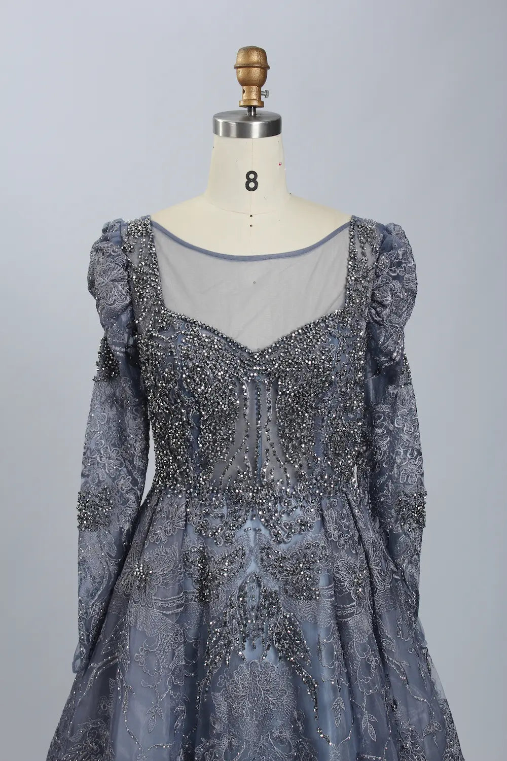 Dark blue beaded V-neck illusion bodice with puffed long illusion sleeves