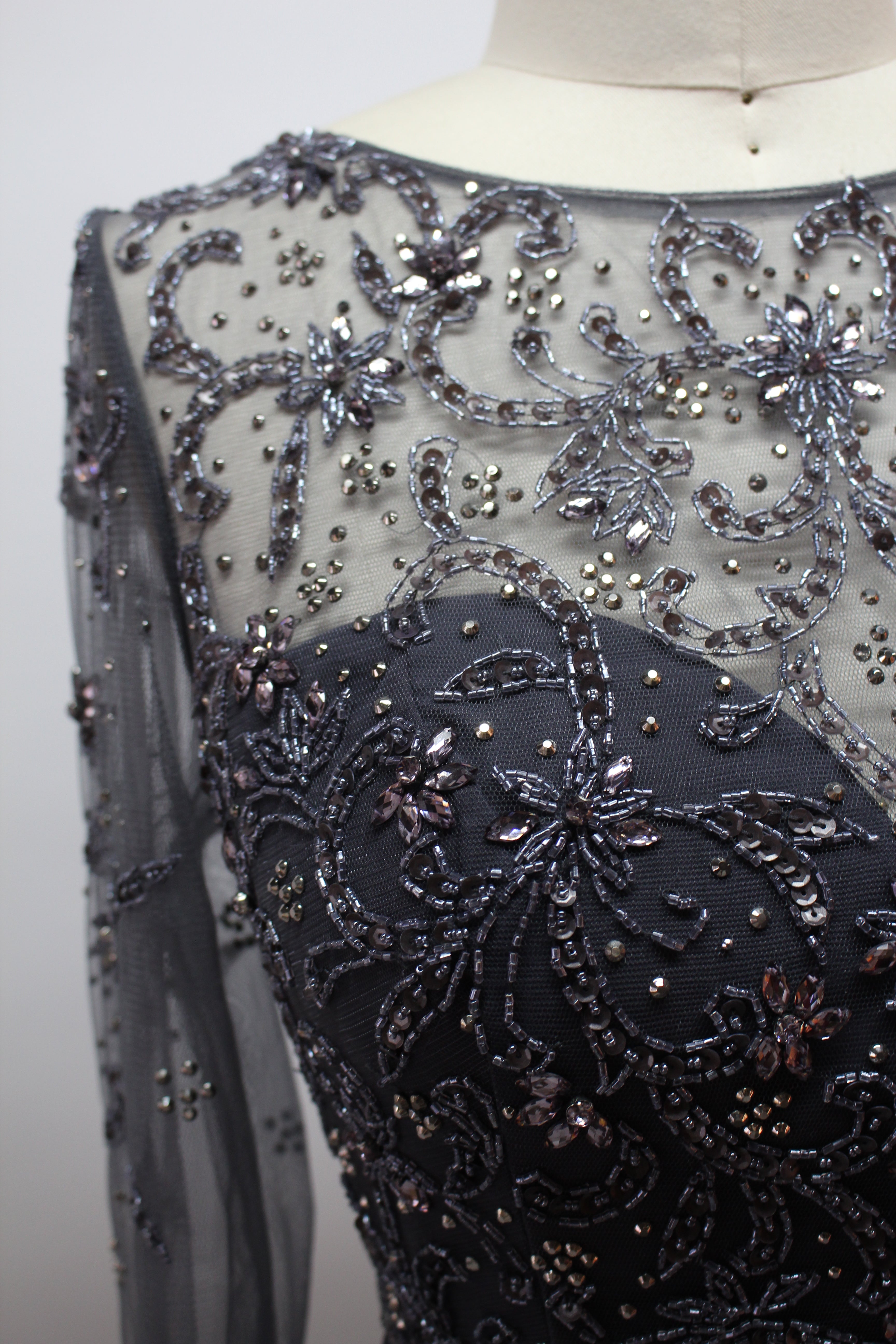 Dark beaded lace bodice with floral bead embroidery on sheer fabric