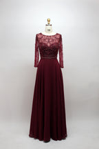 Burgundy long-sleeve beaded lace gown with fitted bodice and A-line skirt