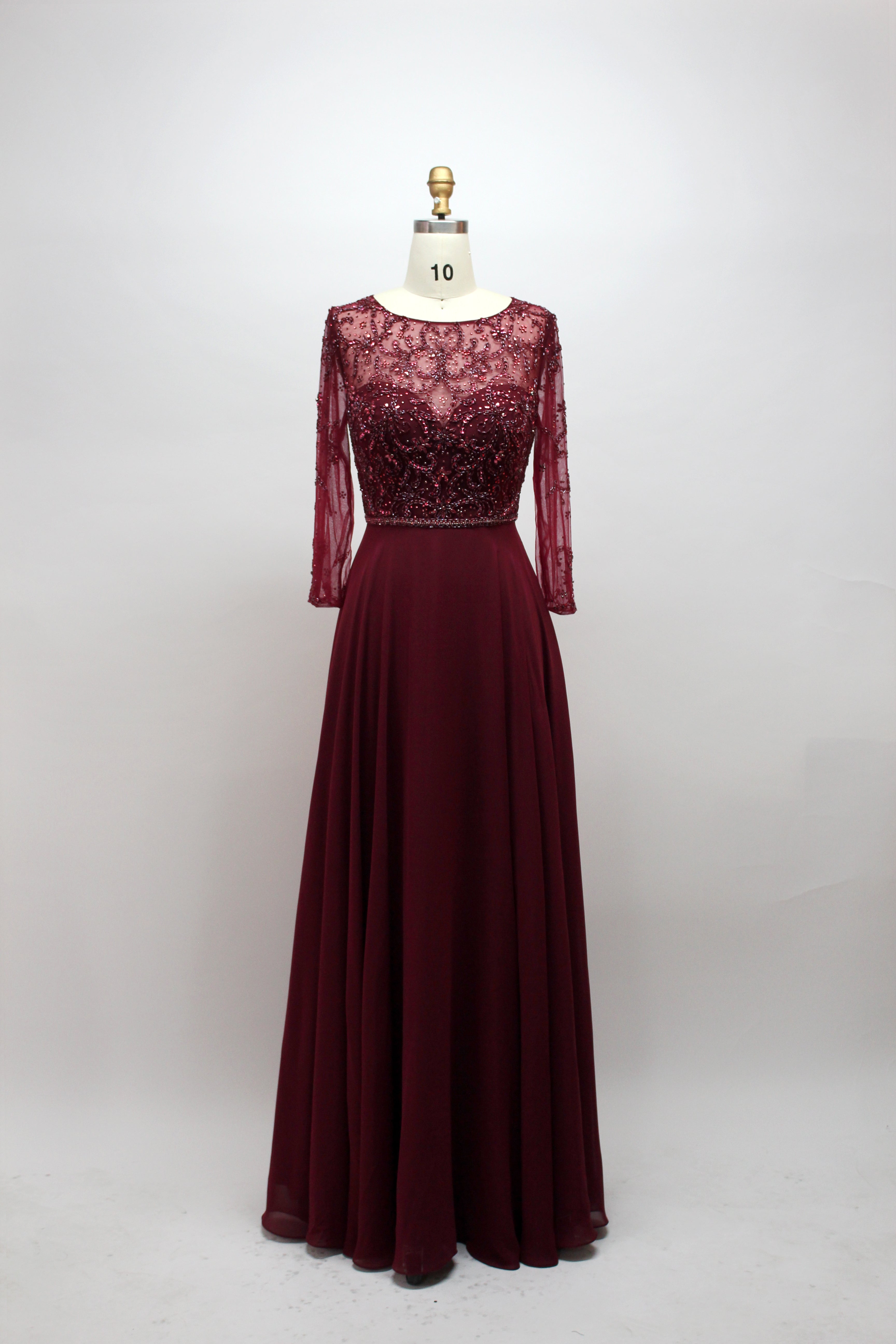 Burgundy long-sleeve beaded lace gown with fitted bodice and A-line skirt