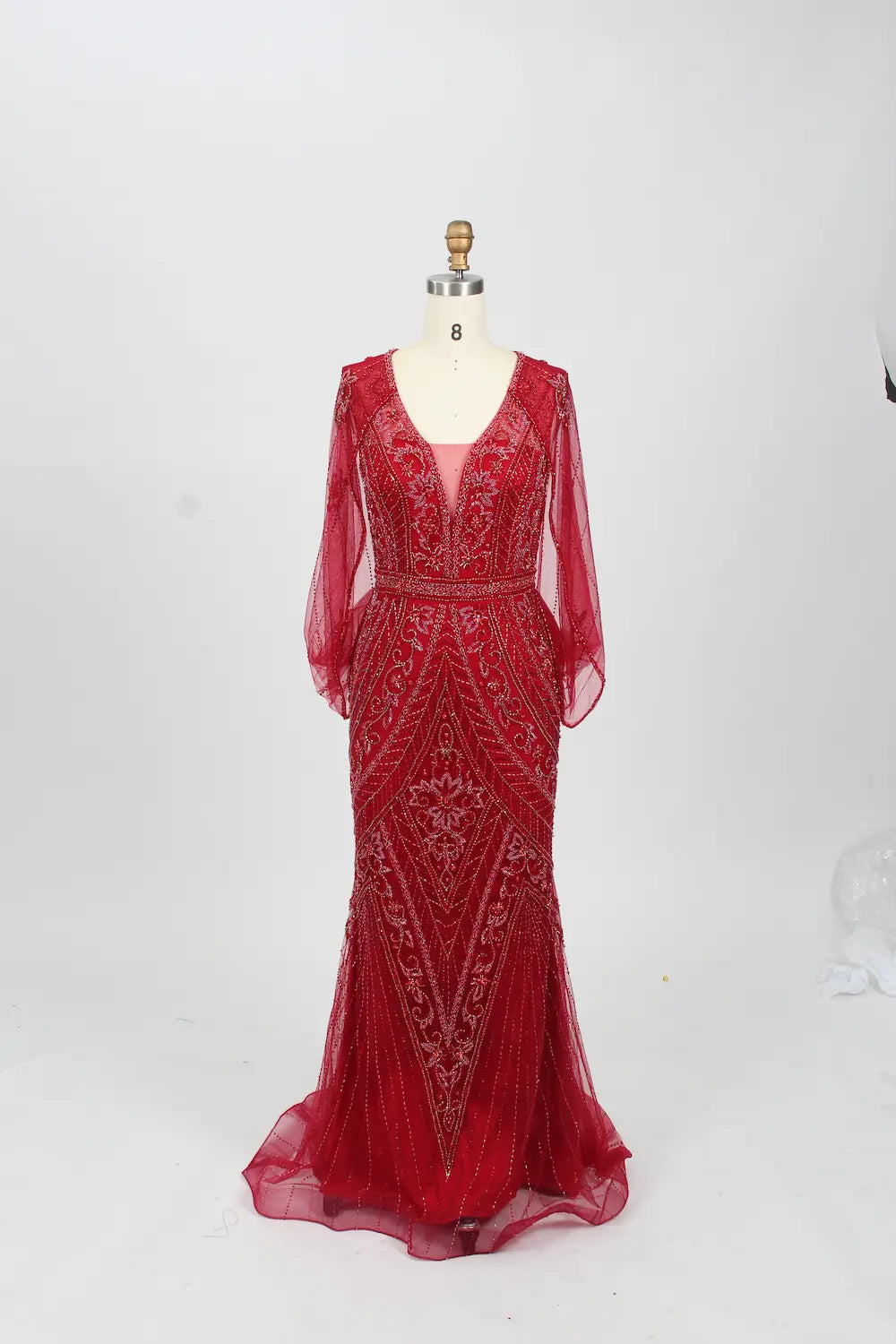 Red beaded V-neck mermaid gown with sheer long sleeves and fitted tulle skirt