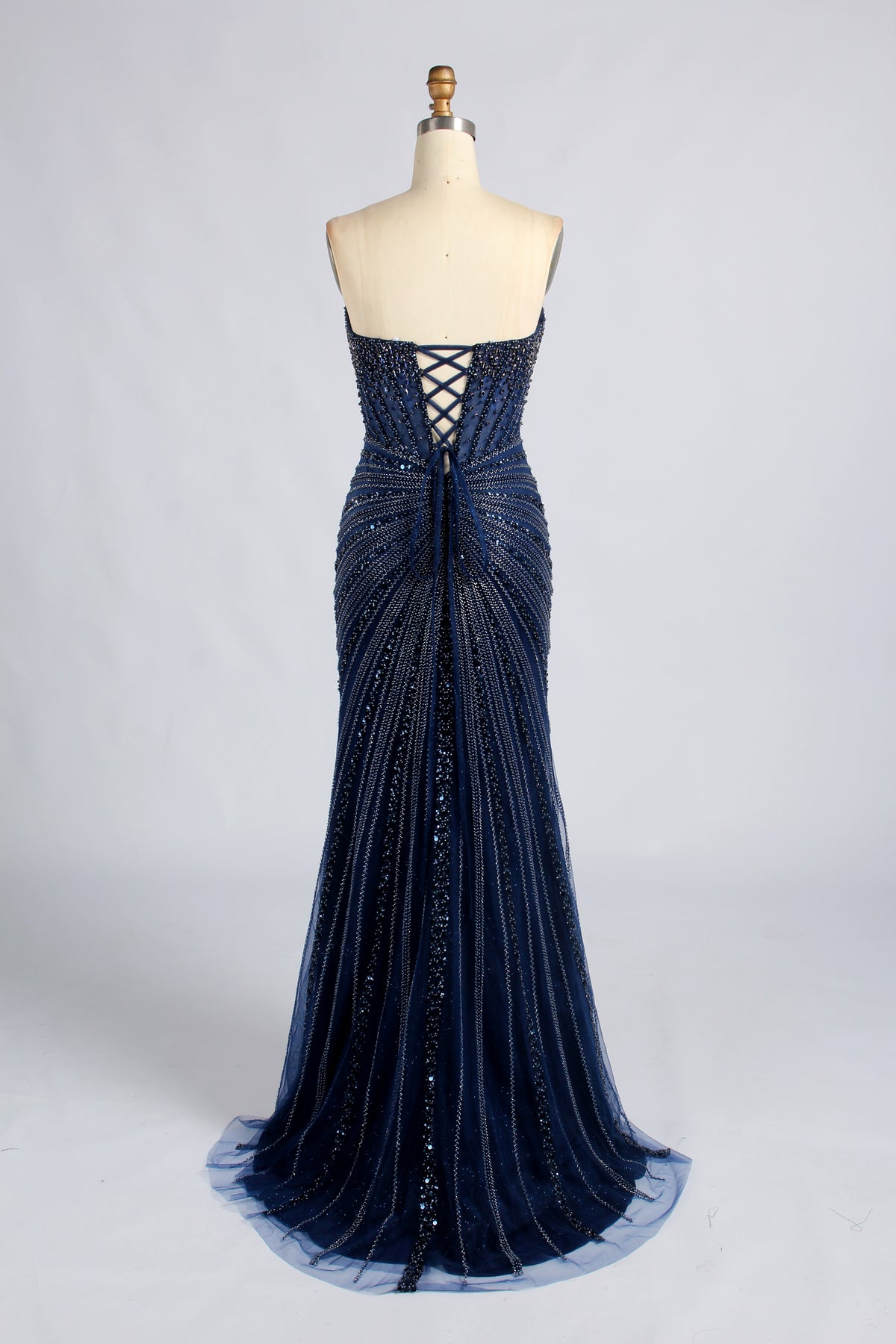 Navy strapless beaded mermaid prom dress with crisscross open back