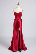 Red strapless satin mermaid prom dress with beaded corset bodice