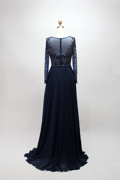 Navy blue long-sleeve dress with openwork back beading and flowing floor-length skirt