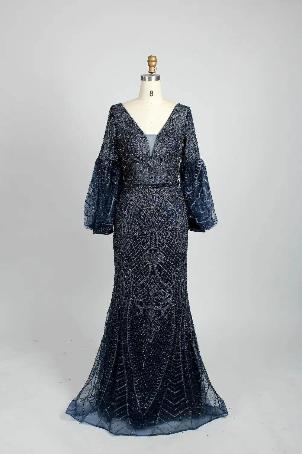 Beaded A-line cape gown in dark navy with V-neck and elbow puff sleeves