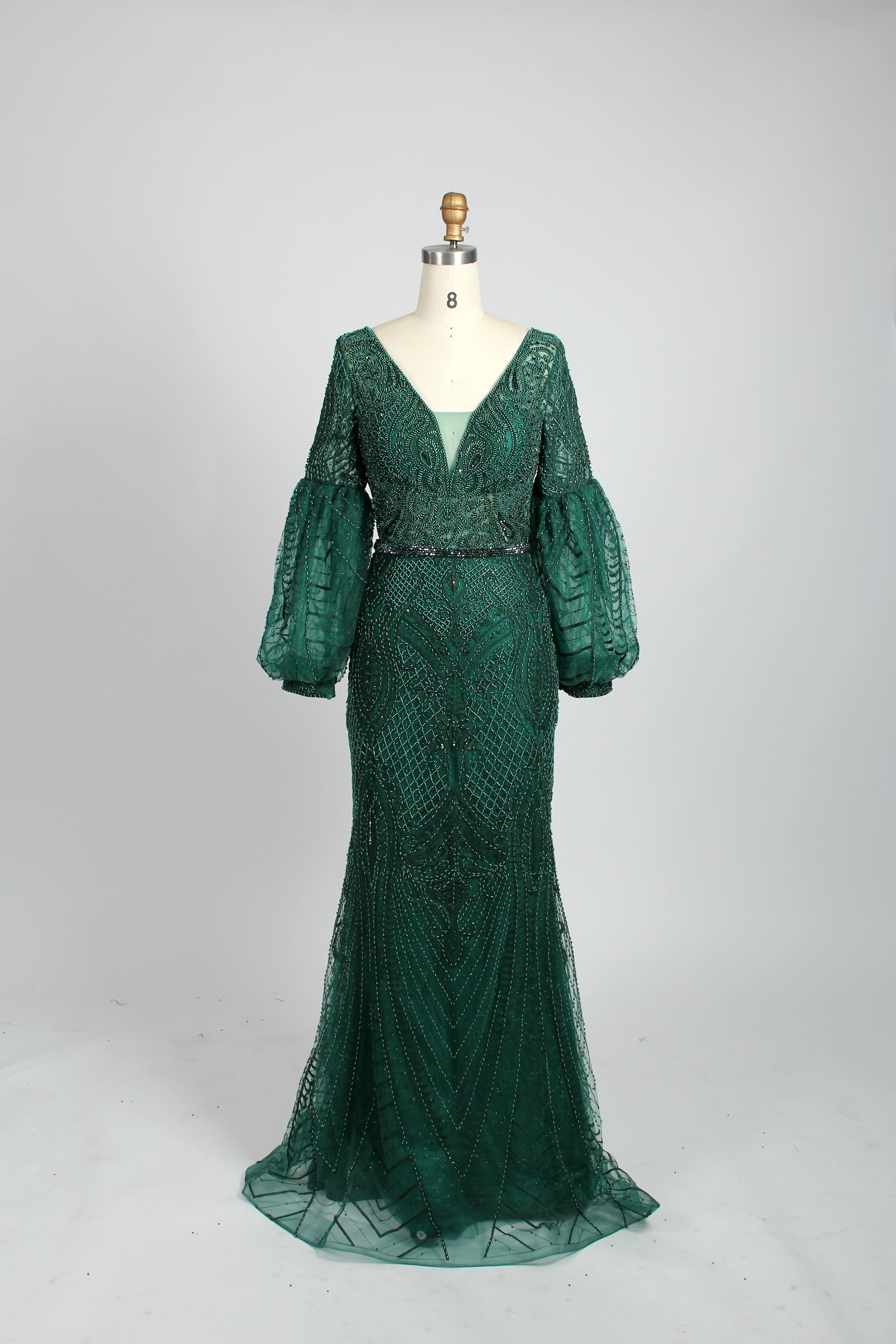 Emerald green sequin mermaid evening gown with V-neck and long puff sleeves