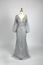 Silver sequin mermaid evening gown with V-neck and long puff sleeves