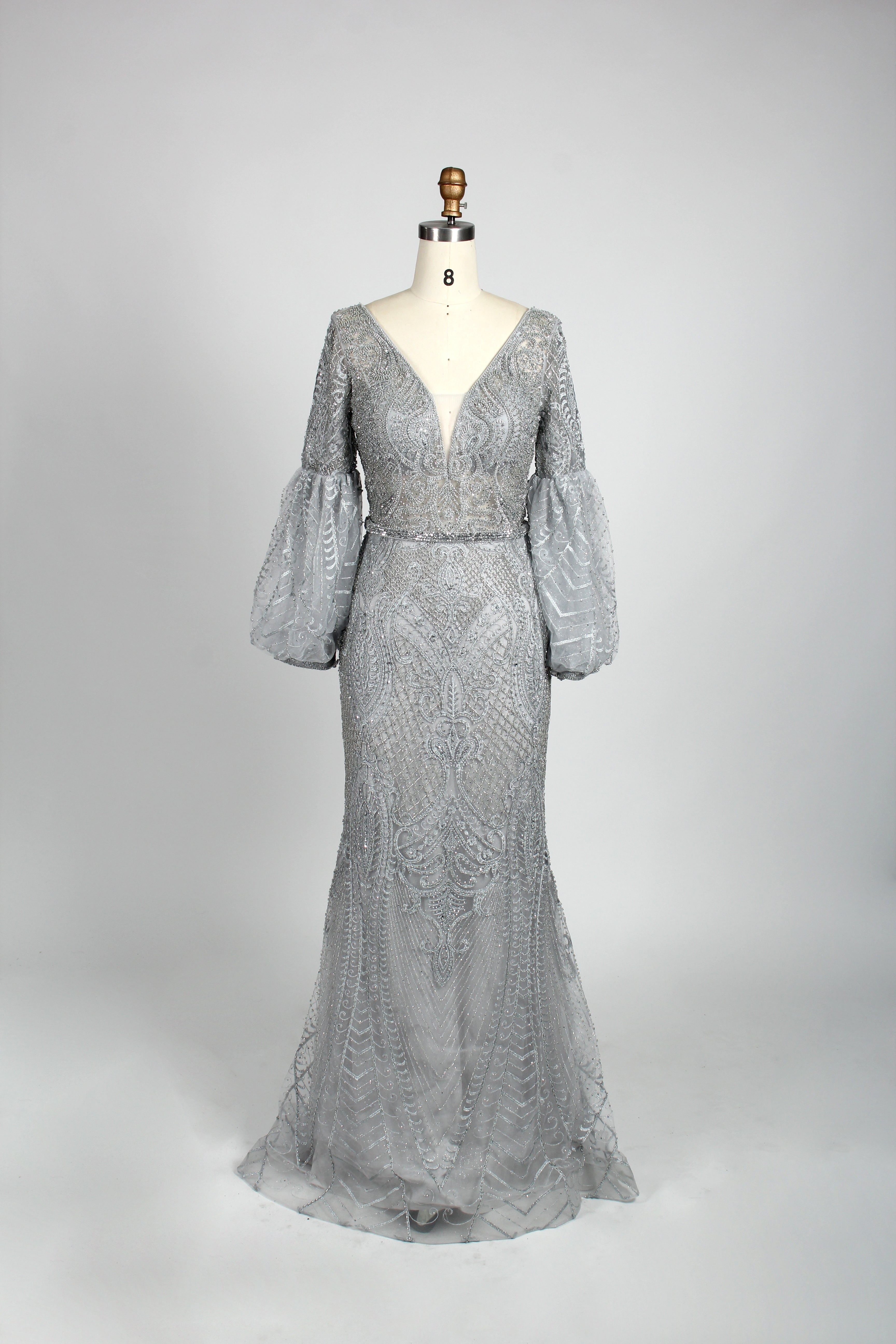 Silver sequin mermaid evening gown with V-neck and long puff sleeves
