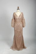 Beaded A-line cape gown in nude blush with V-neck and long puff sleeves