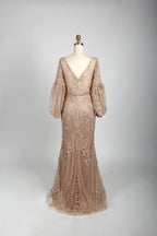 Beaded A-line cape gown in nude blush with V-neck and elbow-length puff sleeves