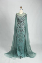 Teal beaded tulle cape mermaid evening dress with long sleeves and fitted skirt
