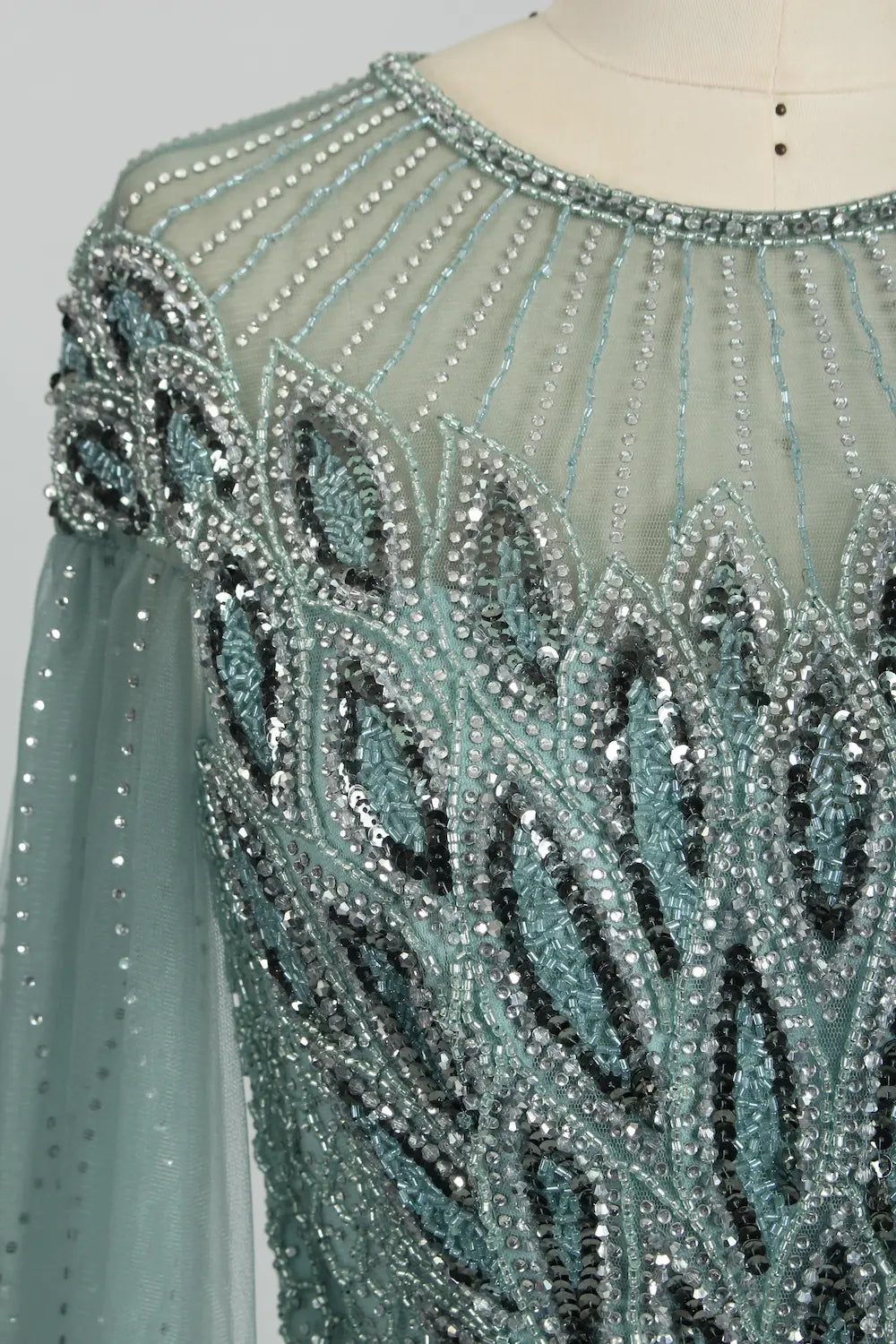 Teal embellished beaded tulle cape dress shoulder and neckline detail