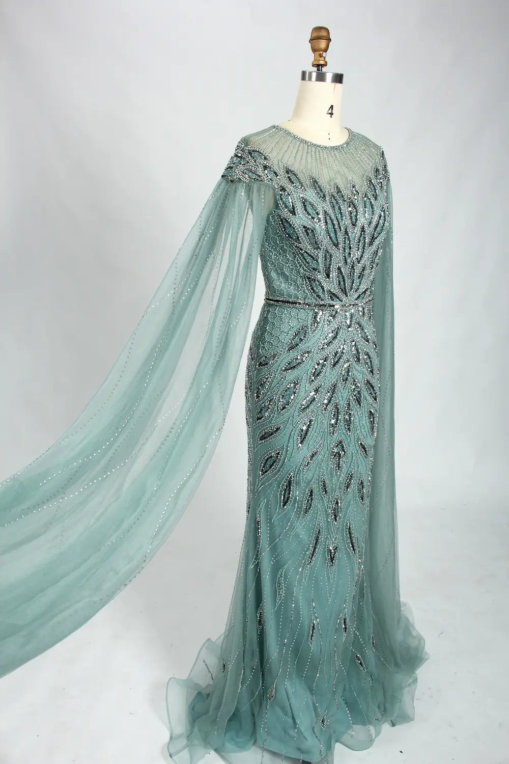 Teal beaded tulle cape mermaid dress with draped cape and fitted bodice